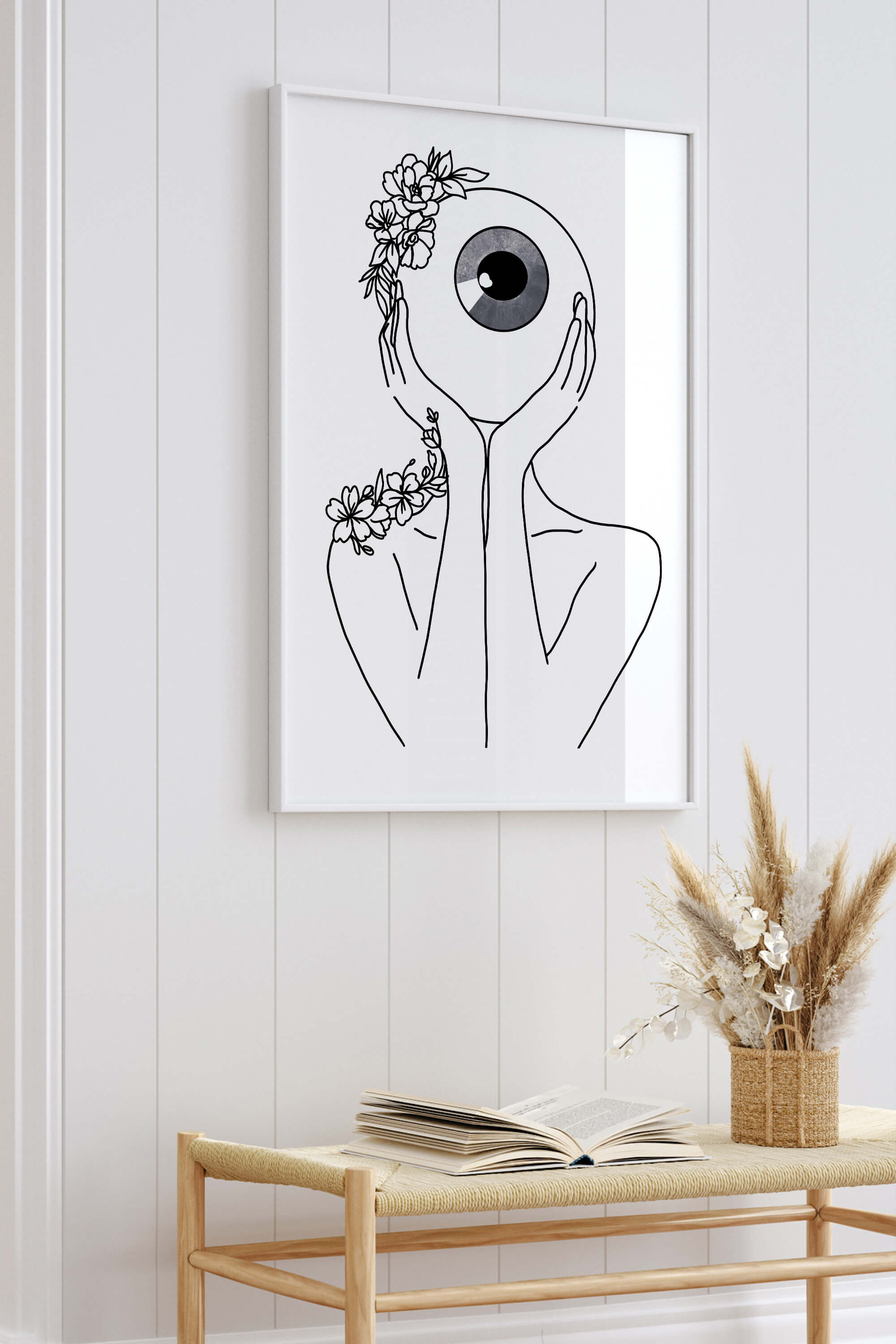 Dive into the abstract world with this striking art print, showcasing a harmonious blend of an abstract woman and an eye ball. The black and white composition exudes modern elegance, making it an eye-catching piece for diverse interior styles.