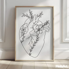 Close-up of human heart line art with floral details, showcasing intricate and meaningful design elements.