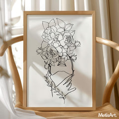 Black and white floral head woman face drawing hanging in a bedroom, bringing a touch of expressive art to the room.