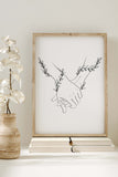 Elegant portrayal of a couple surrounded by botanical elements. Nature-inspired art print with a minimalist touch.