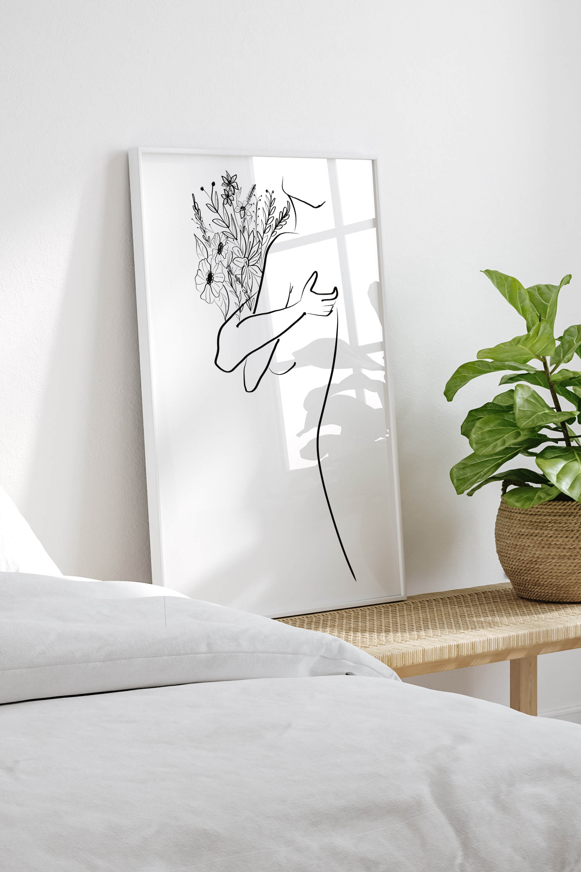 Botanical wall art with a floral abstract theme for the bedroom. This art print features delicate flowers, adding a touch of nature's elegance to your living space. The minimalist design and versatile style make it a standout piece.