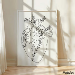 Black-and-white floral heart anatomical art print in a contemporary living room, offering a chic and emotional decor element.