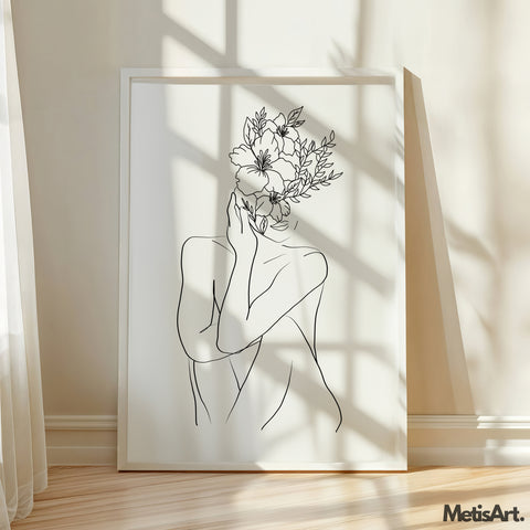 Black and white flower head woman drawing displayed on the wall, adding elegance and empowerment to the room.