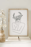 Artistic portrayal of a woman with a flower-headed crown, radiating delicate femininity. Monochrome print for an extraordinary touch to your living space.