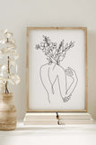Empowering feminist botanical line art for wall decoration. The intricate details showcase a harmonious blend of nature and femininity. Elevate your space with this unique and meaningful art print.