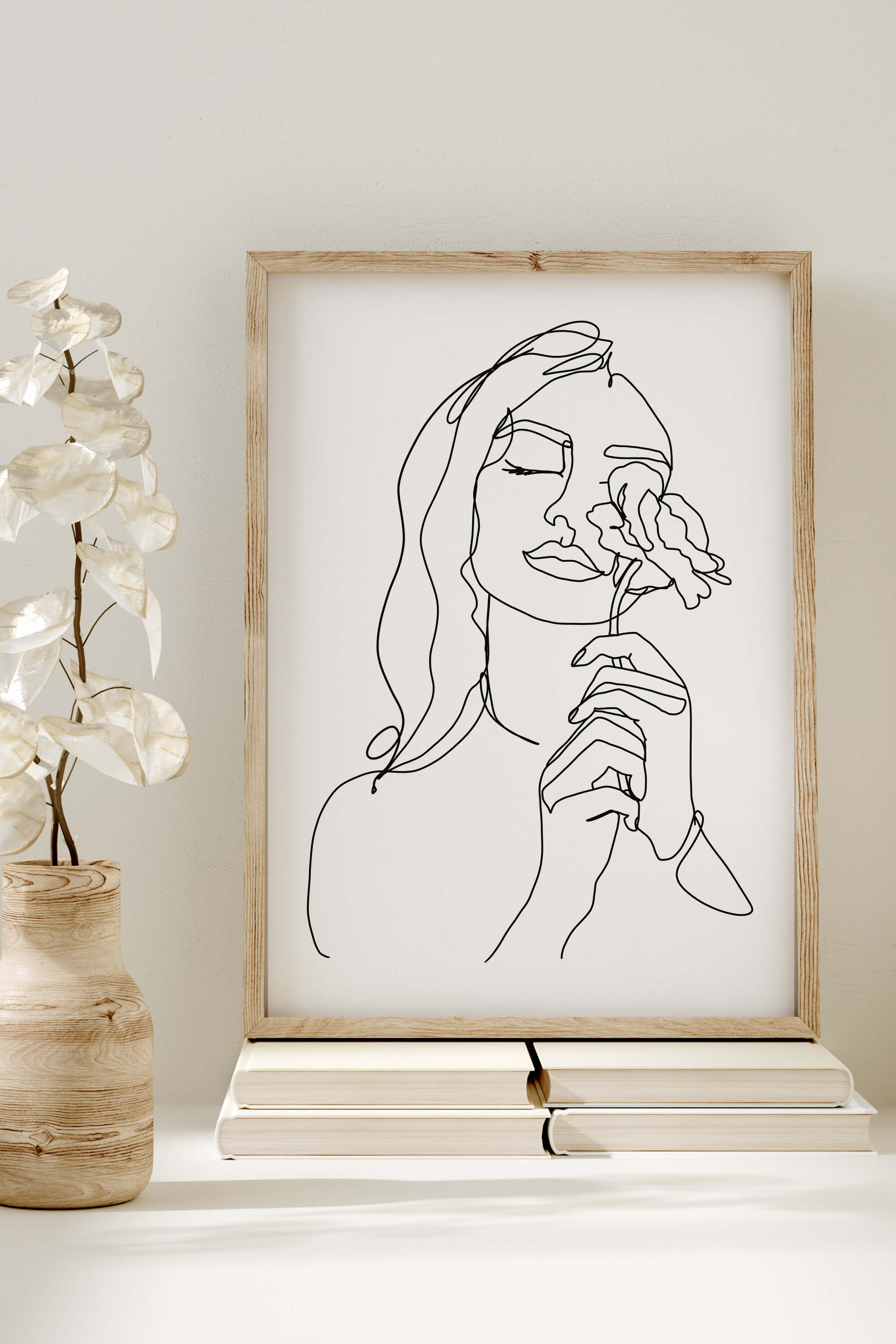 A monochrome line art print capturing the essence of feminine elegance. Delicate details and graceful strokes make this artwork a perfect blend of minimalism and femininity.