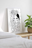 Boho-inspired wall art celebrating feminist expression, portraying a woman with a flower-covered face. A modern symbol of strength and beauty for any space.