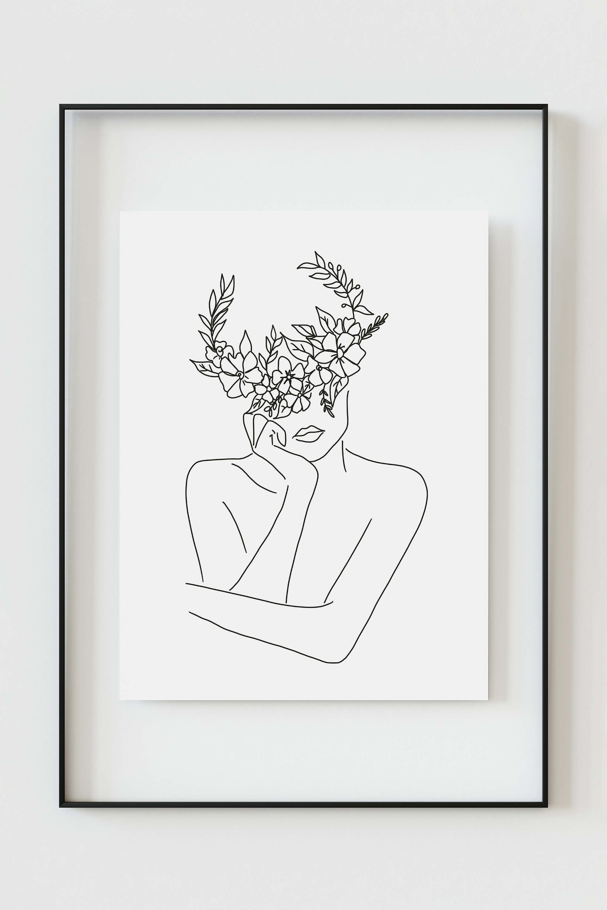 Close-up of an art print with an intricate floral crown, revealing delicate details in black and white. A sophisticated and timeless piece for your home decor.