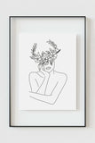 Close-up of an art print with an intricate floral crown, revealing delicate details in black and white. A sophisticated and timeless piece for your home decor.