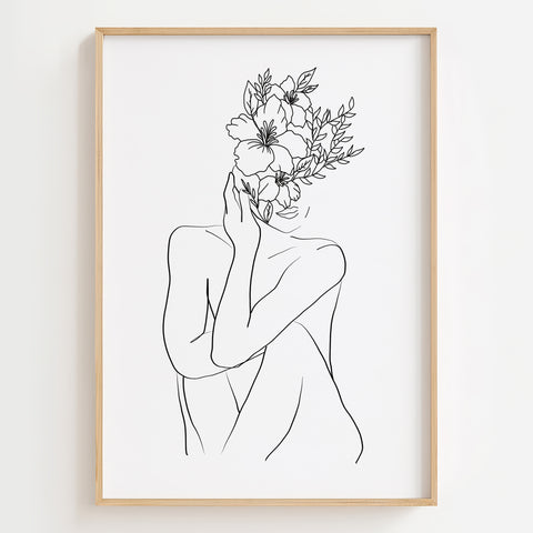 Floral Feminine Monochrome Art Print displayed in a modern living room, highlighting empowerment and beauty.