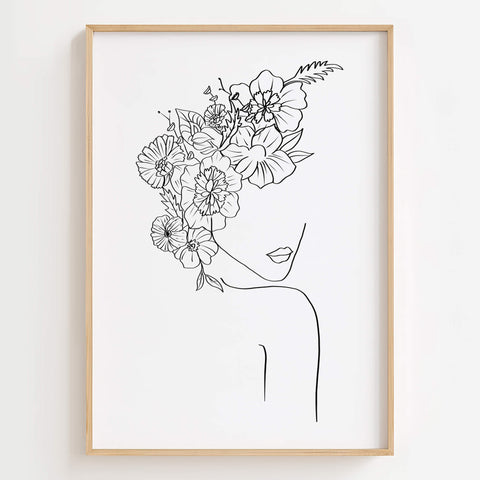 Floral Head Female Line Art Print displayed in a modern living room, adding elegance and feminine charm to the space.