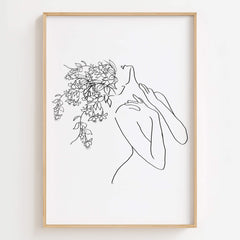 Floral Head Feminine Woman Line Art Print displayed in a modern living room, enhancing the space with elegant and empowering art.
