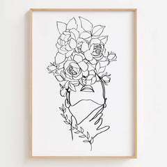 Floral Head Woman Line Art Print displayed in a modern bathroom, adding elegance and femininity to the space.