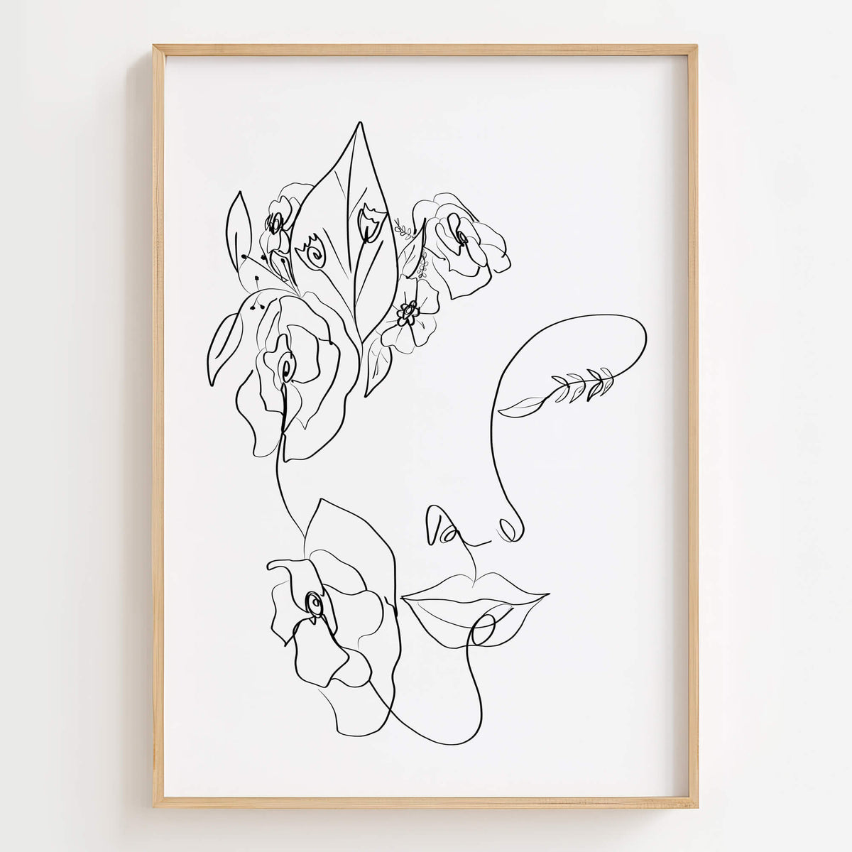 Floral Woman Face Portrait Line Art Print displayed in a modern living room, adding nature-inspired elegance to the space.