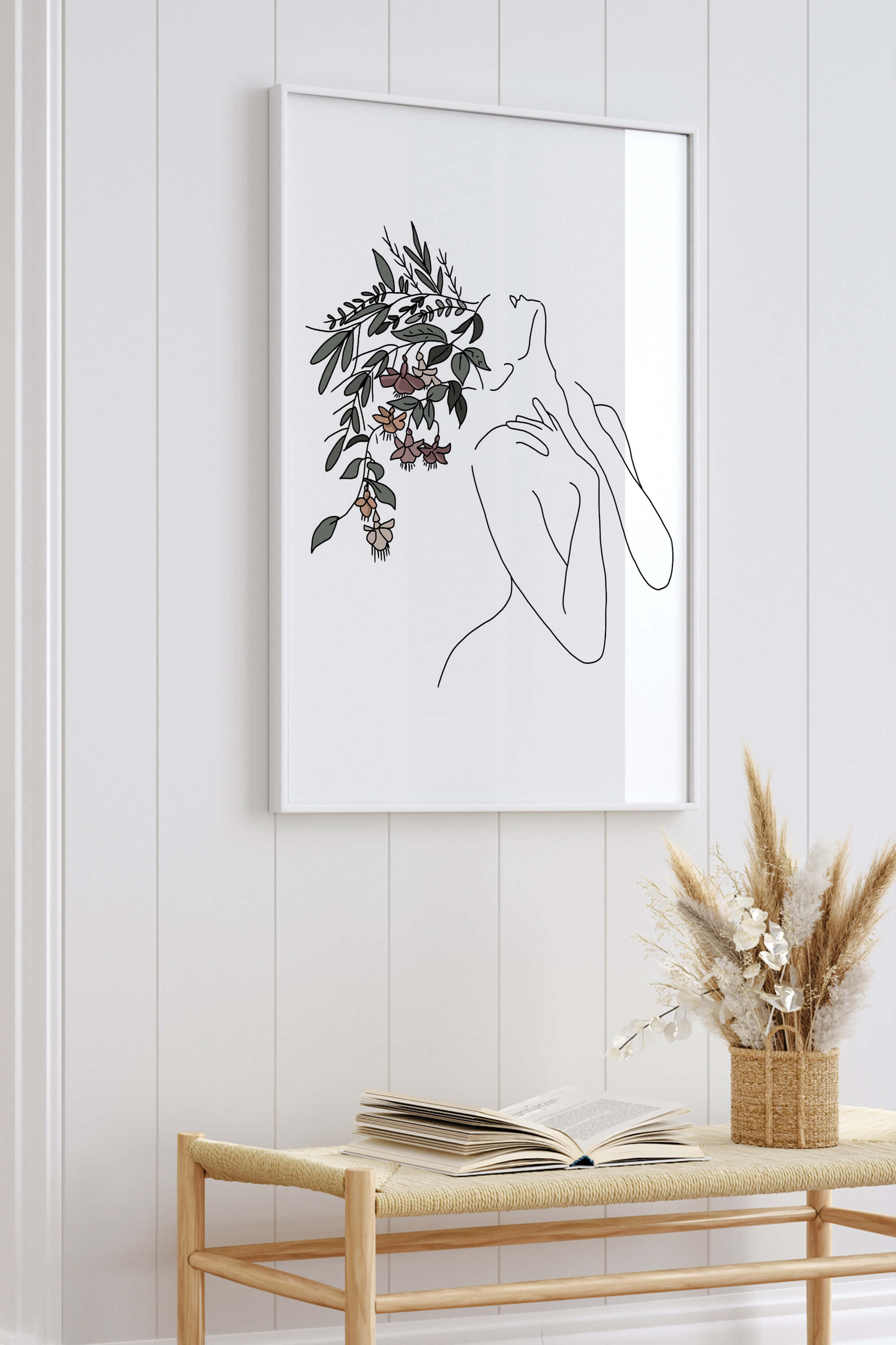 Elegant greenery wall decor featuring flower heads and botanical elements for a touch of nature indoors.