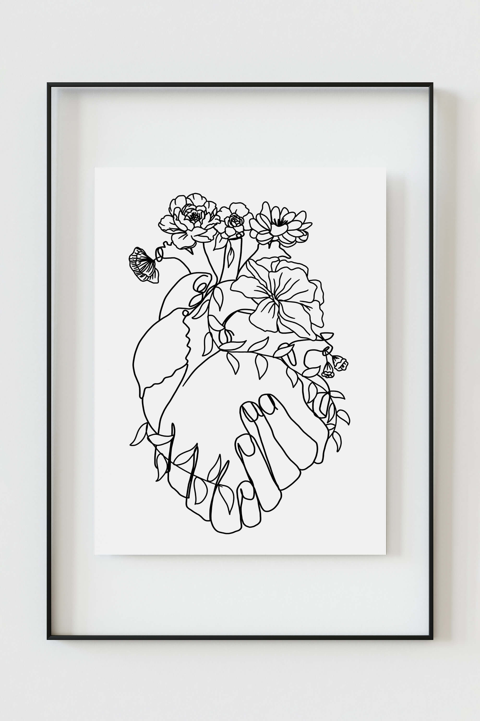 A black and white art print that shows the human heart anatomy with aesthetic flower lines. The print combines organic and geometric shapes and represents the beauty and fragility of life and love.