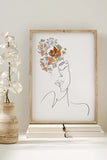 Intricate line art of a woman's floral portrait, embodying delicate elegance for contemporary wall decor.