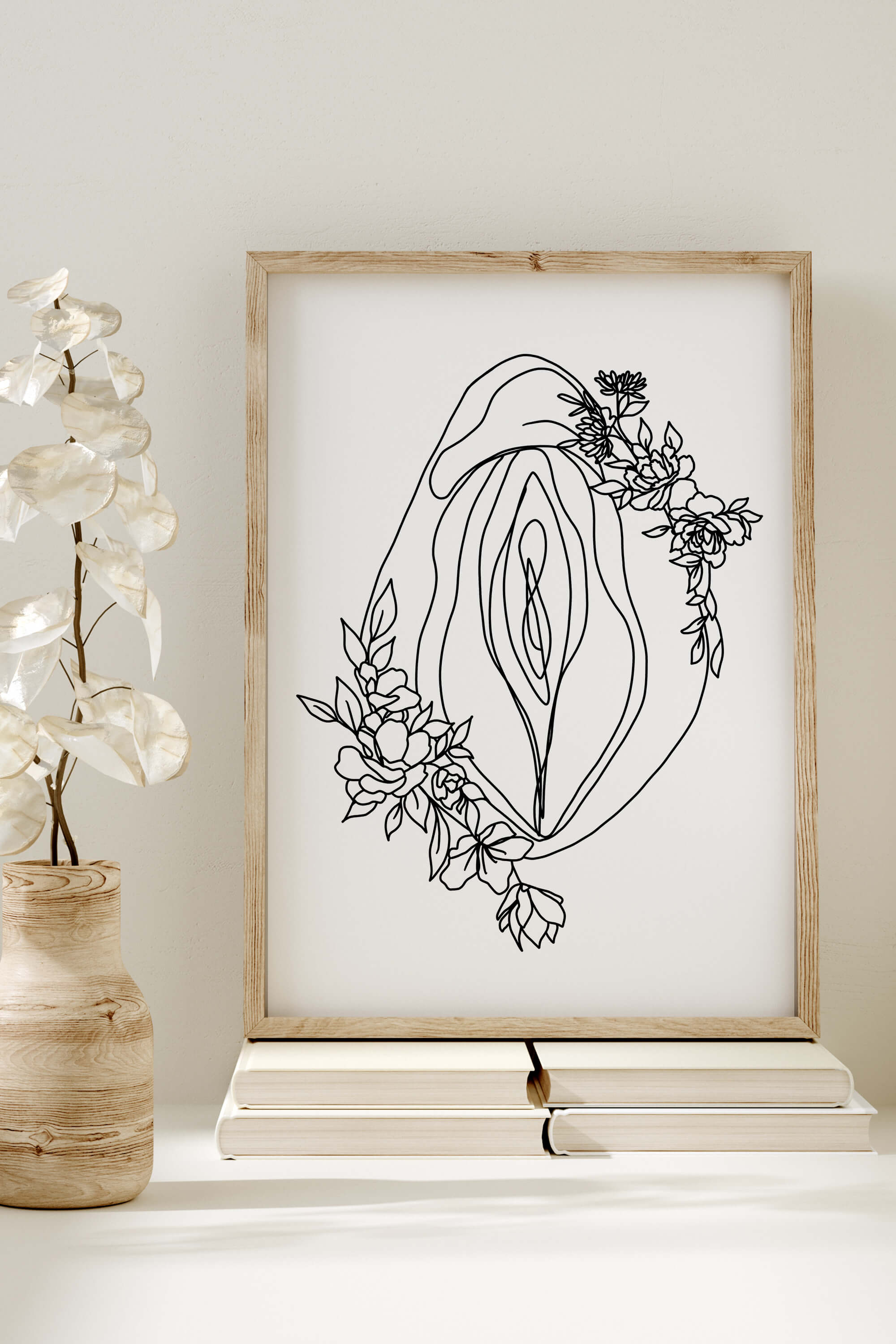 Minimalist art print for wall decor, featuring a monochrome floral vagina design. The simplicity of the lines adds a modern touch, creating an empowering atmosphere. Perfect for those who appreciate contemporary feminist art.