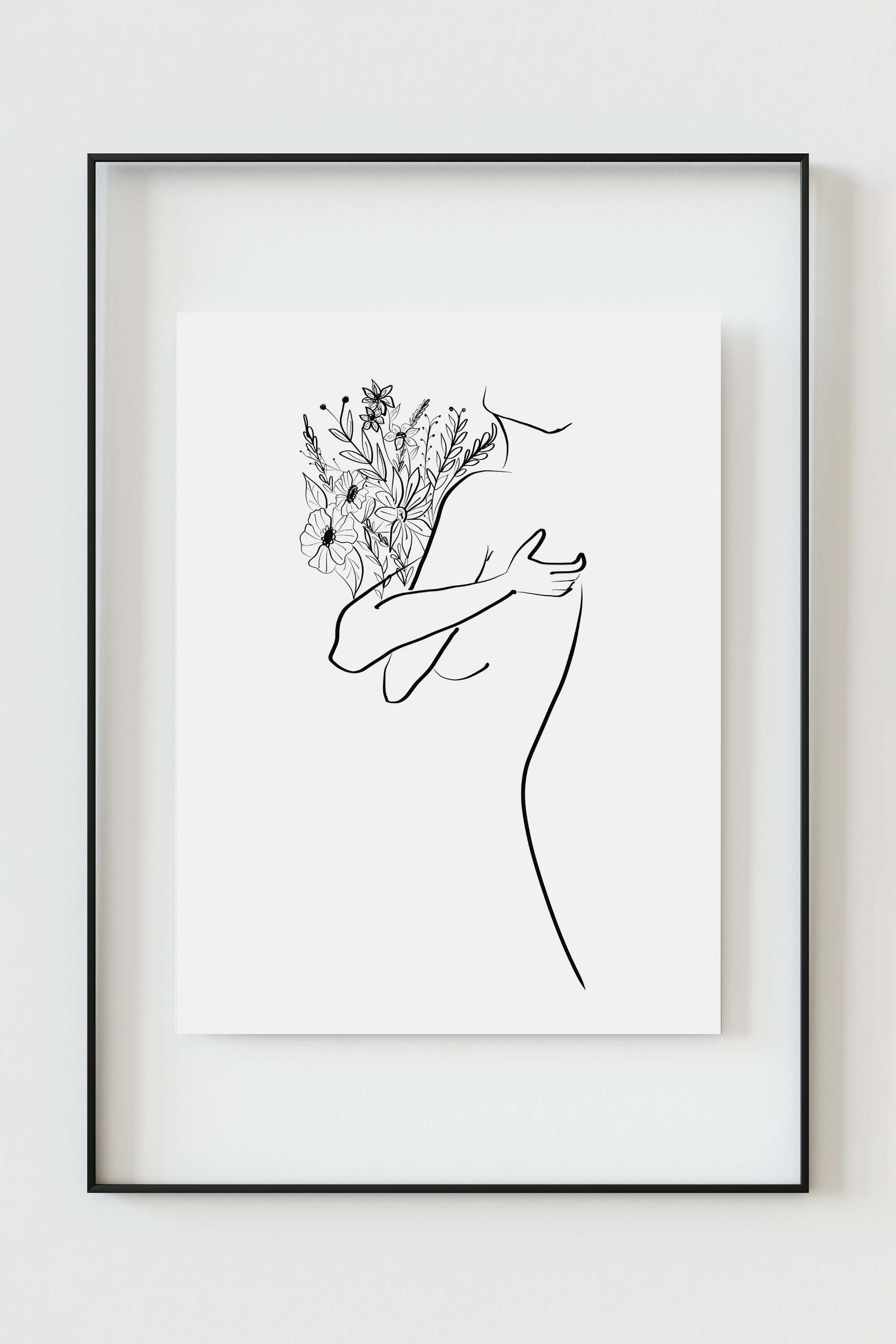Minimalist line drawing of flowers art print, designed for bedroom decor. This black and white print blends simplicity with elegance, creating a tranquil atmosphere. Ideal for those seeking a modern touch with nature-inspired elements.
