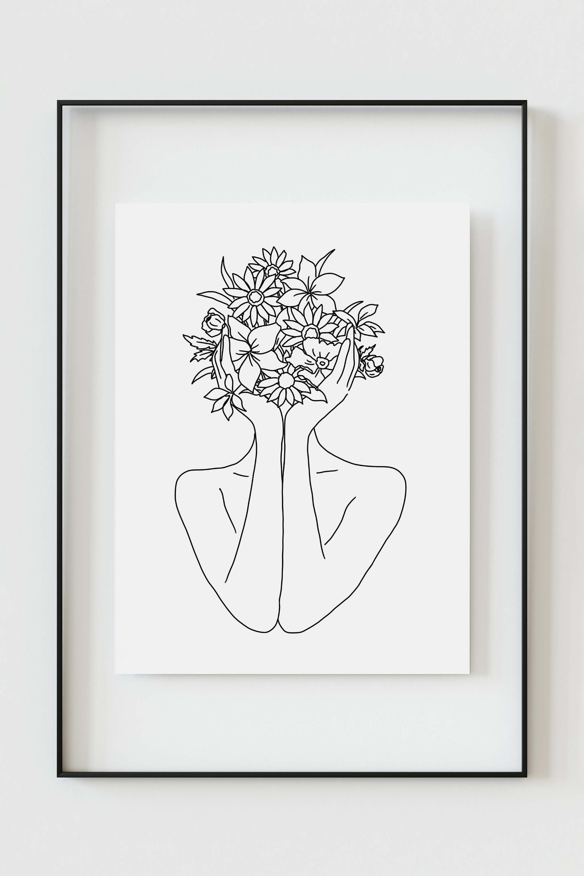 Modern floral art in a woman's line drawing featuring delicate hands and abstract flower elements. The fine details and free-flowing lines create a captivating visual experience.