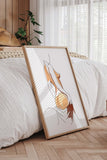 Contemporary nude line art featuring a woman's back, adding a touch of sophistication to living room wall aesthetics.