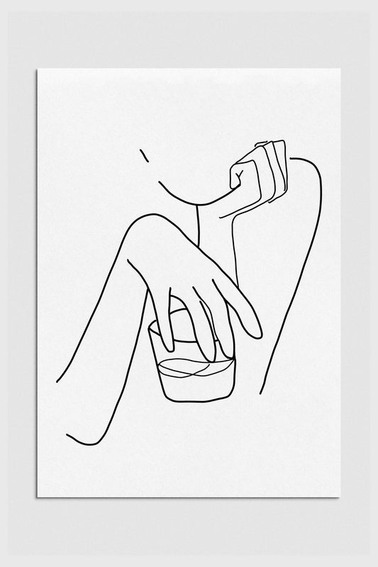 A black and white line art print of a woman holding a glass of whiskey. The print has a sophisticated and elegant style and shows the woman's face and upper body in a graceful pose. 2000