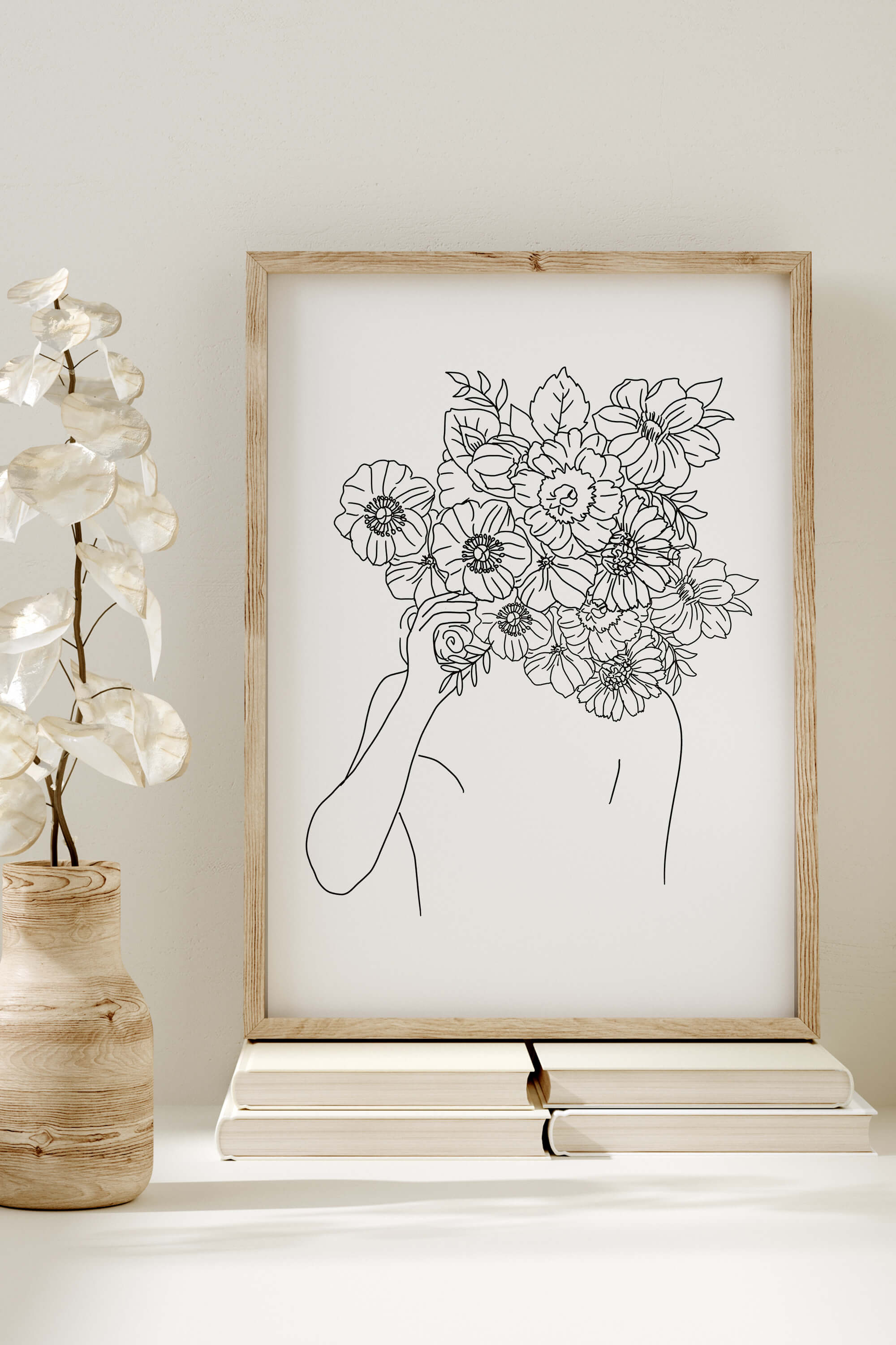 An elegant line art print showcasing the delicate beauty of a woman with a flower head – a monochrome masterpiece that merges sophistication with botanical charm.