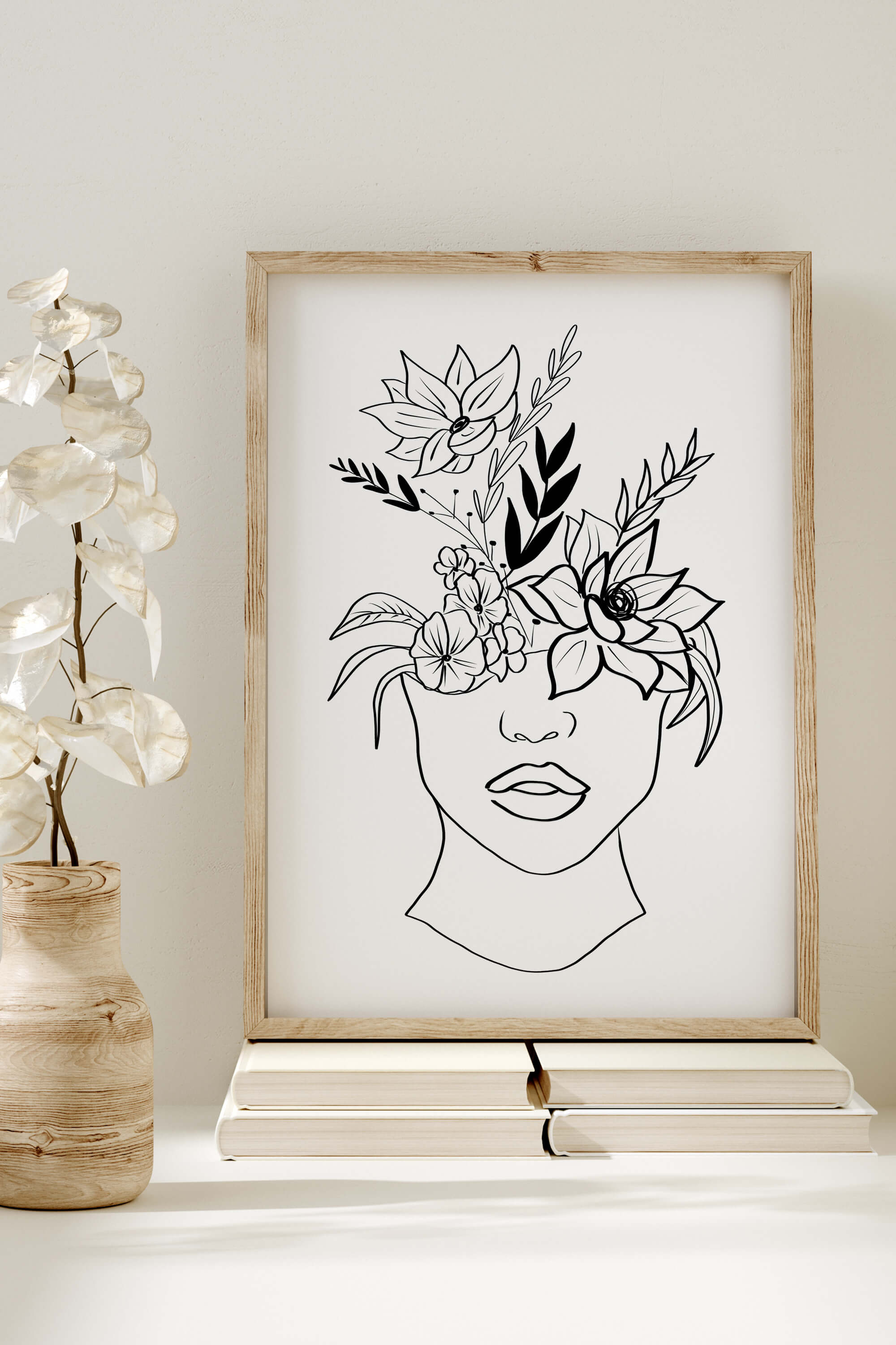 Elegant female illustration in black and white. This floral head woman art print combines simplicity and sophistication, creating a timeless monochrome masterpiece.