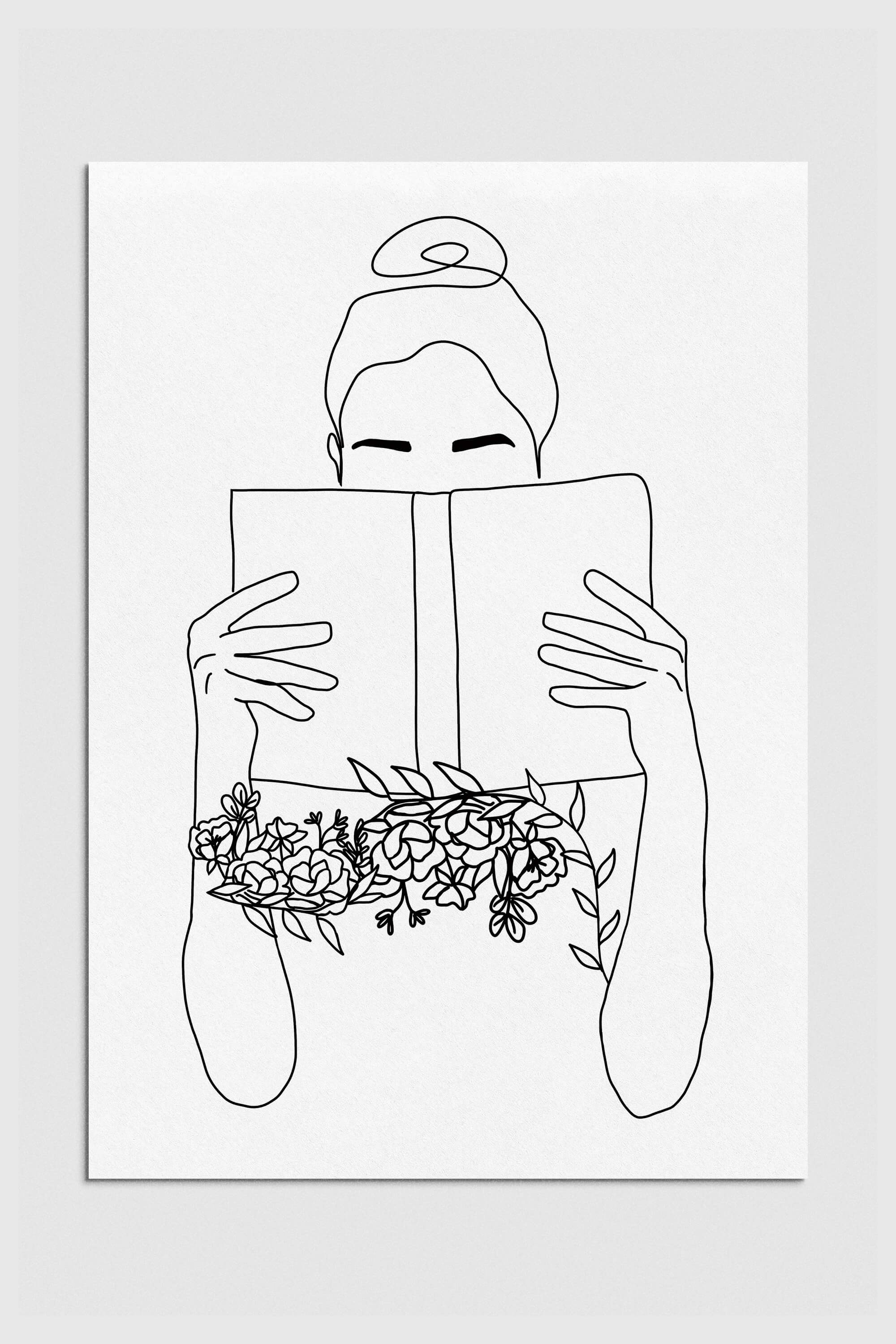 Monochrome serenity art print featuring an elegant woman engrossed in a book amid floral elements. Black and white aesthetic with captivating simplicity, perfect for sophisticated wall decor.