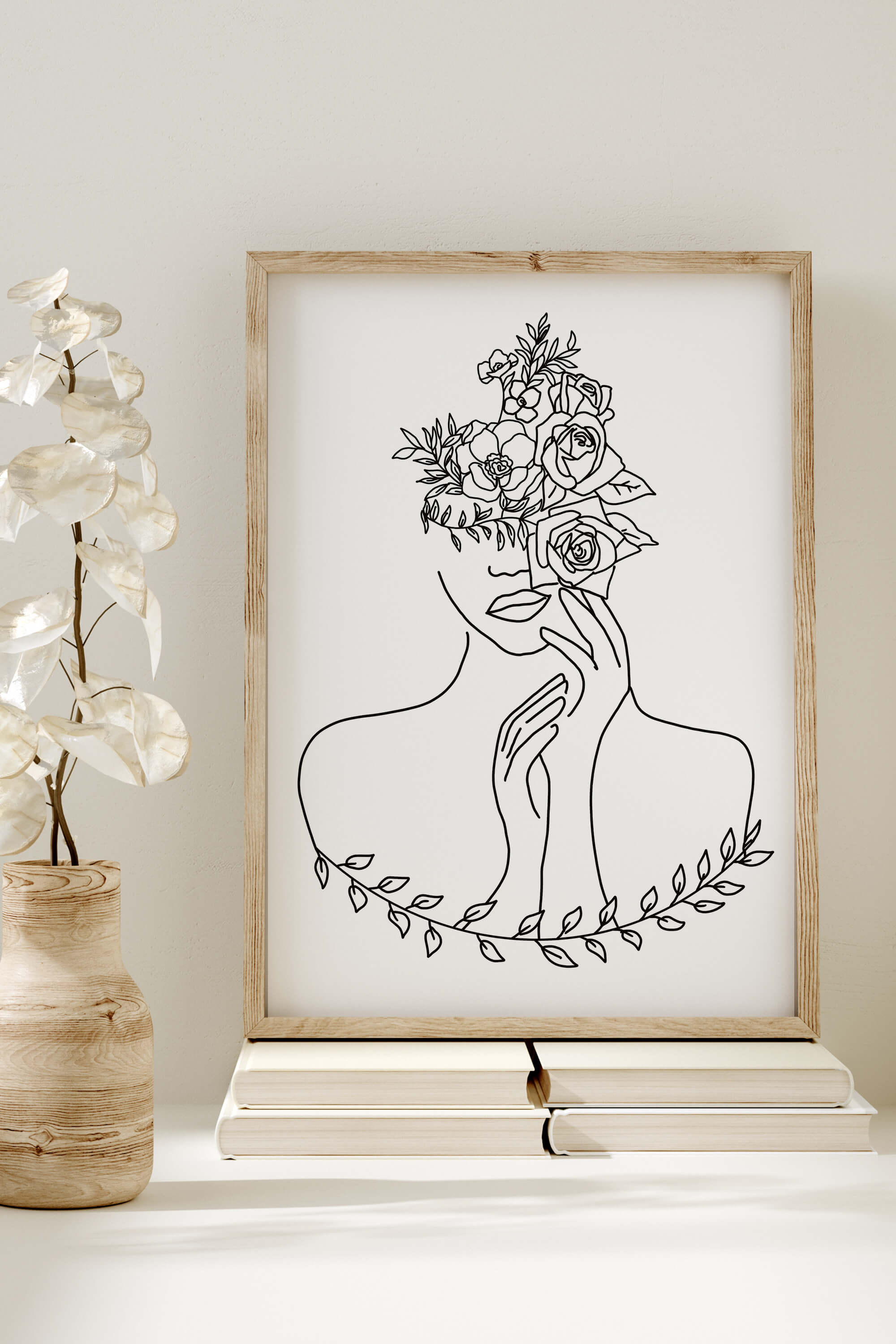  A timeless black and white art print showcasing a captivating portrait through intricate line art. The contrast and simplicity of the design create a visually striking piece that adds an artistic flair to any room.