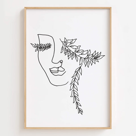 Nature-Inspired Woman Face Line Art Print displayed in a bohemian bedroom, adding serenity and tranquility to the space.