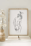 A captivating black and white sketch showcasing the grace of a woman's body. The detailed yet minimalistic lines capture the essence of femininity, providing a unique and sophisticated perspective on the female form.