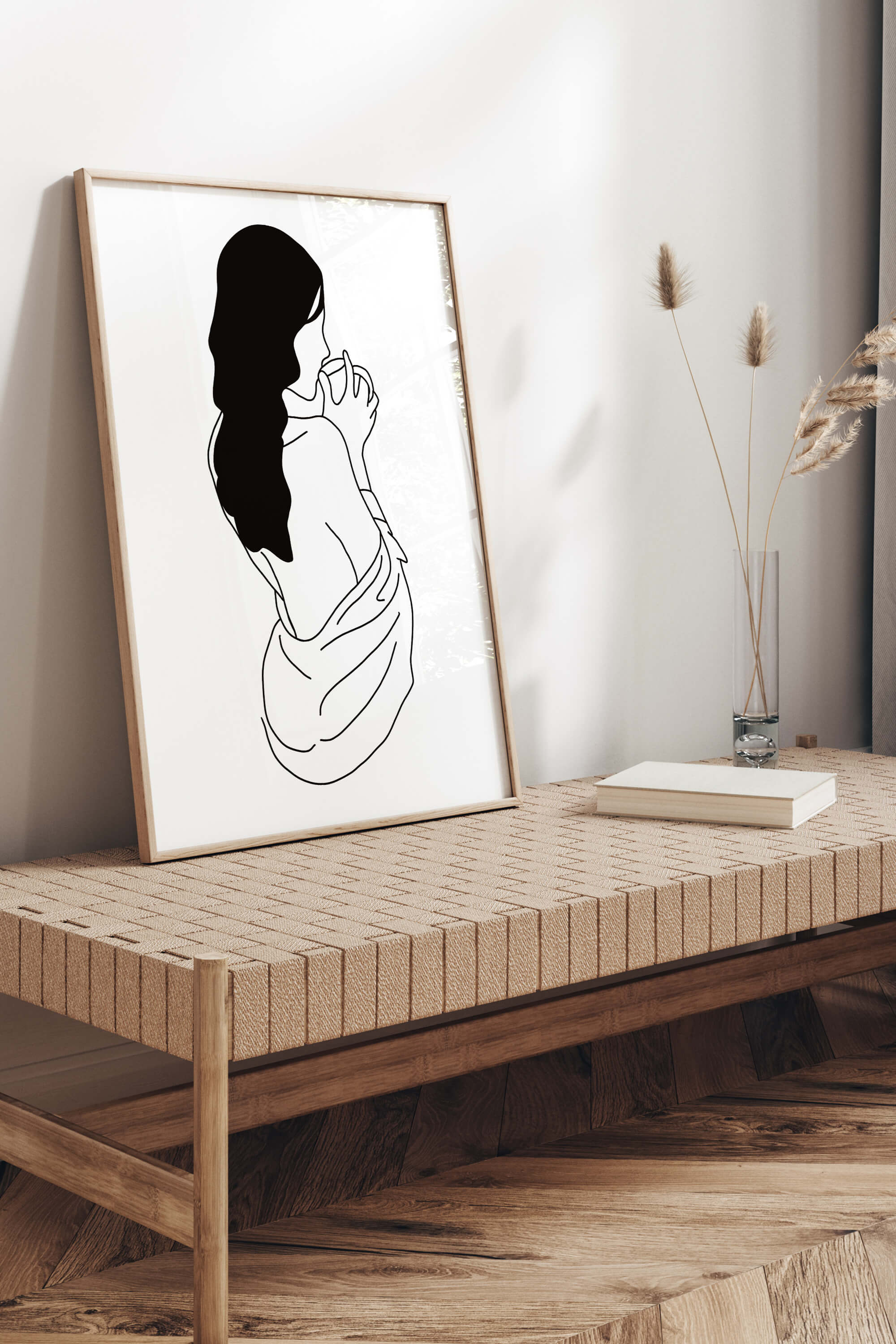 Experience the art of relaxation with this sensual minimalist line art featuring a woman's back. The gentle lines and soothing tones create a harmonious blend, inviting you to create a sanctuary. Elevate your living space with this chic and relaxing art print.