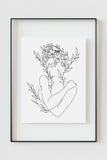 Experience the harmonious blend of line and nature in this captivating wall art. The artwork showcases the delicate beauty of the female form intertwined with botanical elegance.